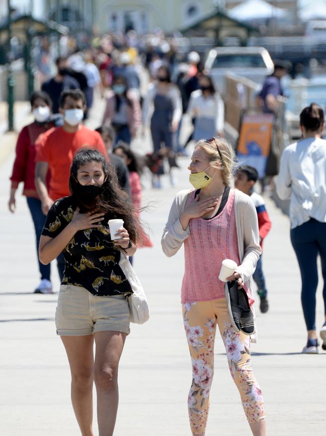 Walkers at a busy St Kilda Pier. Picture: Andrew Henshaw