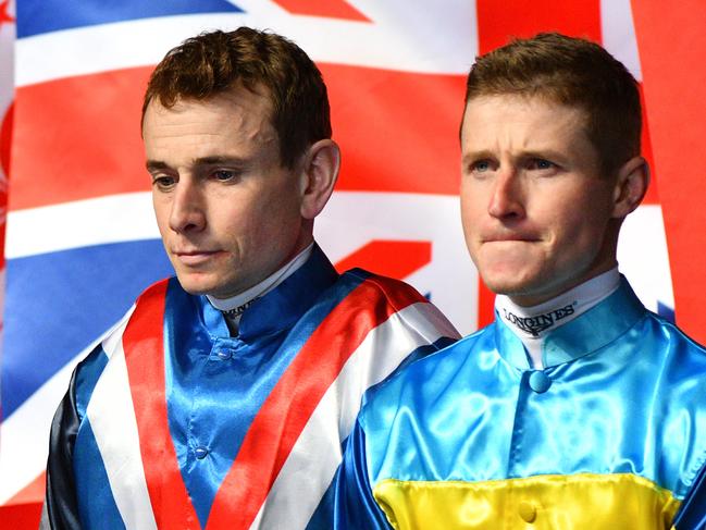 Jockeys Ryan Moore and James McDonald are seen during the opening ceremony during International Jockeys' Championship races at Happy Valley Racecourse in Hong Kong, Wednesday, December 4, 2019. (AAP Image/Vince Caligiuri) NO ARCHIVING, EDITORIAL USE ONLY