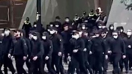 Members of the National Socialist Network march through the Brisbane CBD.