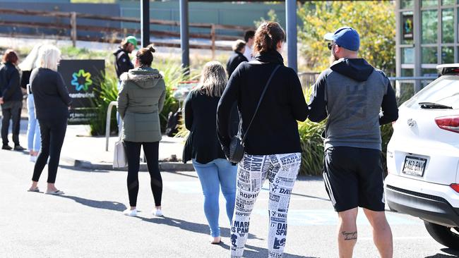 People line up in the car park at Mount Barkers’ Centrelink in South Australia. Picture: AAP