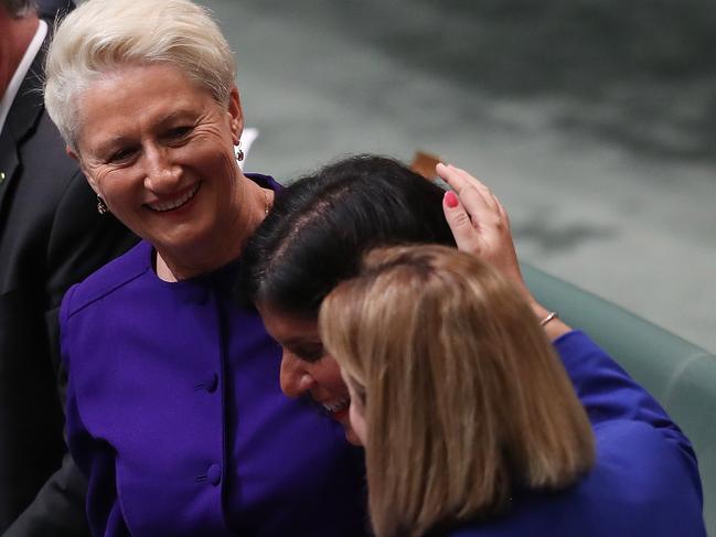 Kerryn Phelps is hugged by Julia Banks and Rebekha Sharkie after the vote passed. Picture Kym Smith