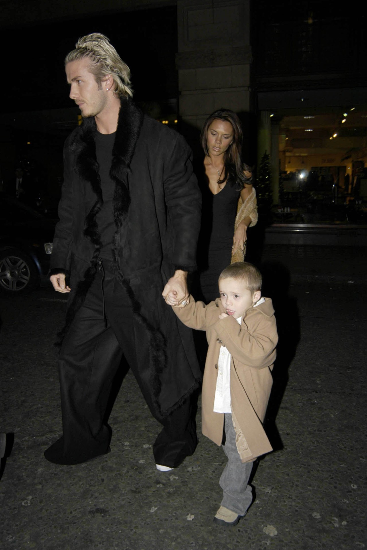 <h2>2002</h2><p>&nbsp;</p><p>Freshly fathered, Becks kept it suave in a long fur coat, and billowy black trousers. From club night to daddy duties.&nbsp;</p>