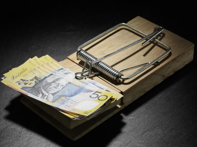 Australian dollars in a mouse trap, generic notes, cash.