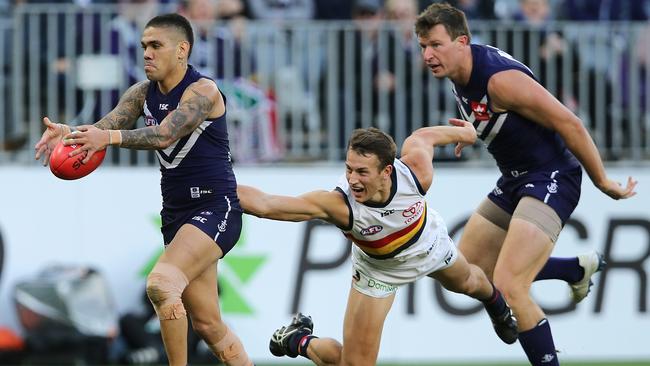 PERTH, AUSTRALIA - JUNE 10: Tom Doedee of the Crows tackles Michael Walters of the Dockers during the round 12 AFL match between the Fremantle Dockers and the Adelaide Crows at Optus Stadium on June 10, 2018 in Perth, Australia.  (Photo by Paul Kane/Getty Images)