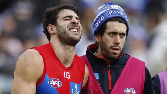 MELBOURNE, AUSTRALIAÃ June 10, 2024.  AFL Round 13. Big Freeze at the G. Collingwood vs Melbourne  at the MCG.   Christian Petracca of the Demons in pain after copping a Darcy Moore knee in the ribs late in the 1st qtr.       . Pic: Michael Klein