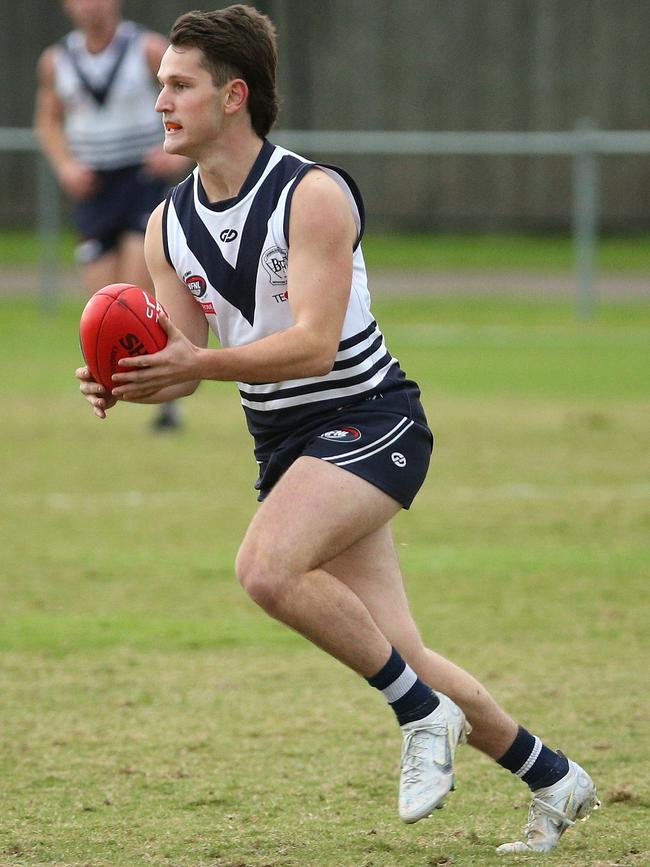 NFL: Jackson Bowne on the run for Bundoora. Picture: Hamish Blair