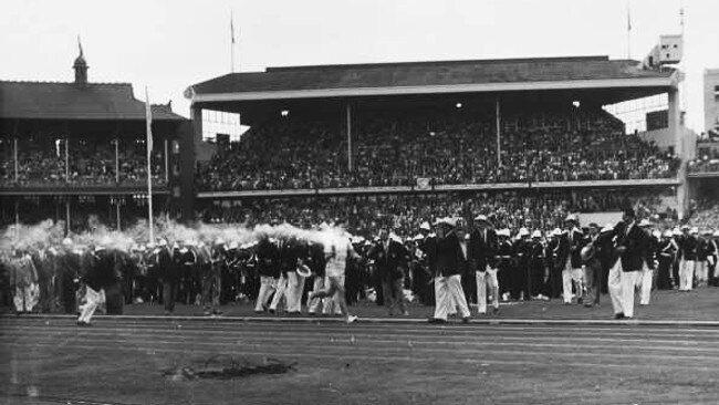 Ron Clarke running across the MCG at the end of the Olympic torch relay.