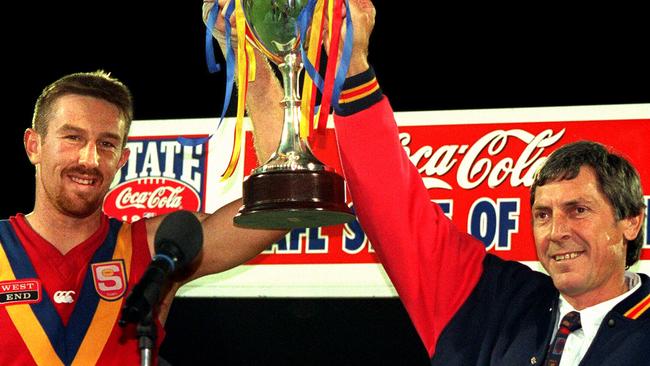 Shaun Rehn with SA coach Russell Ebert after beating WA in a State of Origin interstate match at Football Park in 1998. AFLX could have revived the passion of State-of-Origin football, a craving the players and fans have carried for more than two decades. 