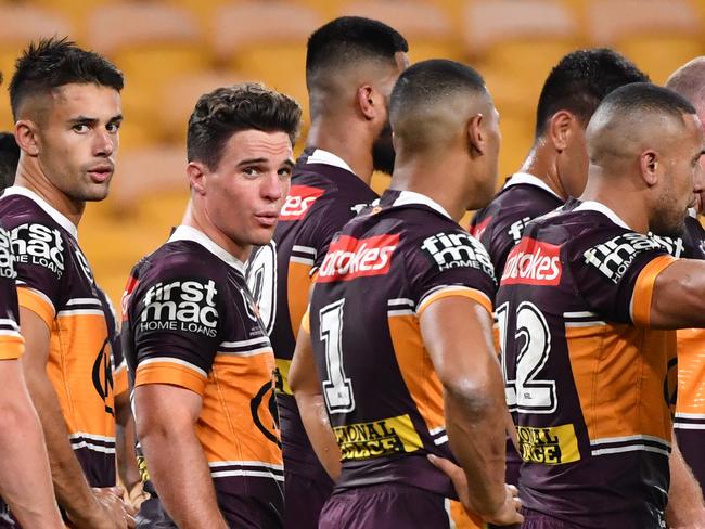 Brodie Croft (centre) of the Broncos is seen with team mates after a Luke Keary of the Roosters scored a try during the Round 4 NRL match the Brisbane Broncos and the Sydney Roosters at Suncorp Stadium in Brisbane, Thursday, June 4, 2020. (AAP Image/Darren England) NO ARCHIVING, EDITORIAL USE ONLY