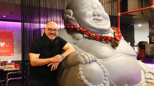 Chinta Ria: Buddha Love owner Simon Goh with a giant Buddha. Picture: Jenifer Jagielski