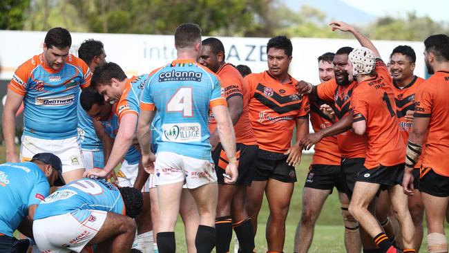 Teammates gather around both Colt Salmond (Pride) and Mat Lamea (Tully) after their heavy collision. . PICTURE: BRENDAN RADKE