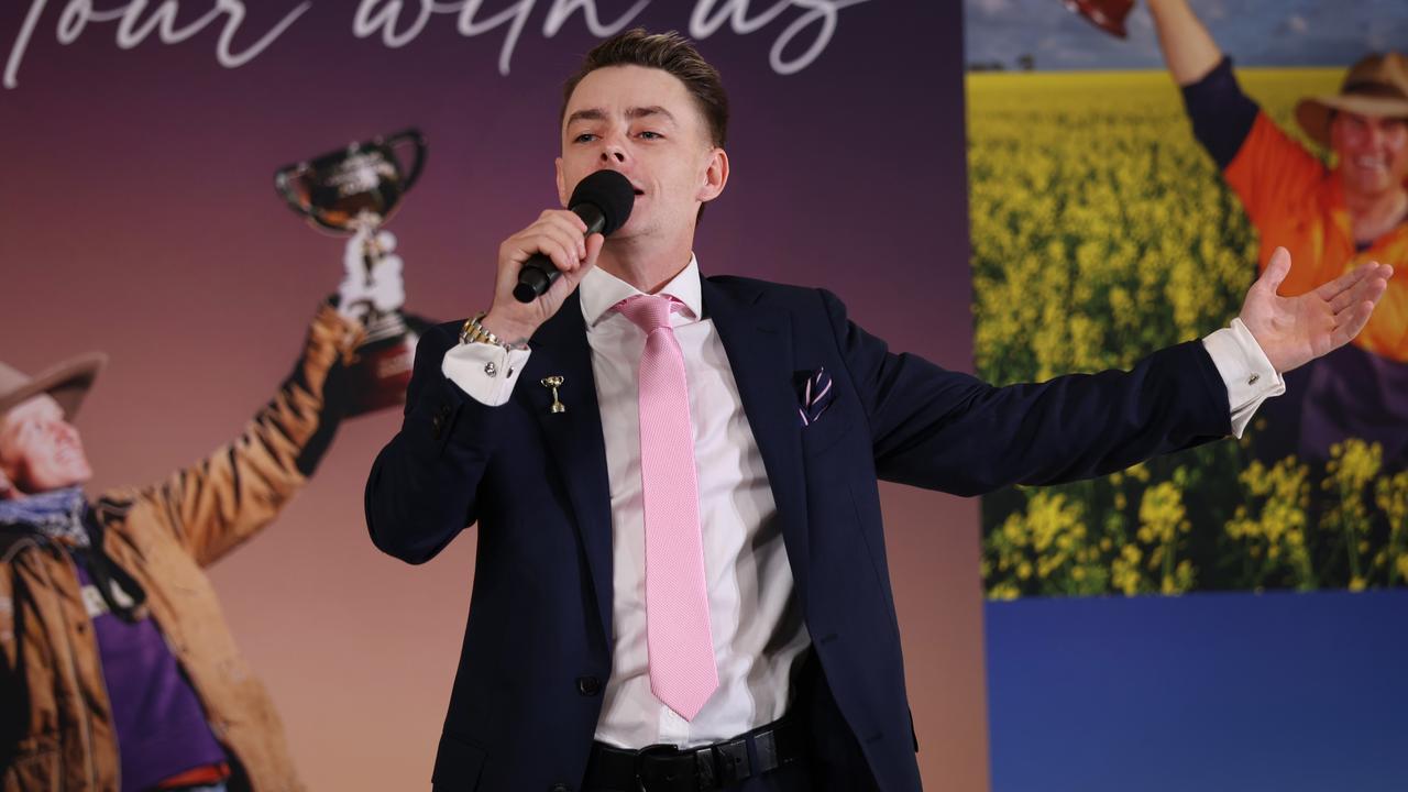 Melbourne Cup winning Jockey Robbie Dolan sings to the audience at Flemington for the launch of the Melbourne Cup Tour for 2025. Picture: David Caird