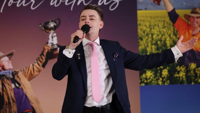 Melbourne Cup winning Jockey Robbie Dolan sings to the audience at Flemington for the launch of the Melbourne Cup Tour for 2025. Picture: David Caird