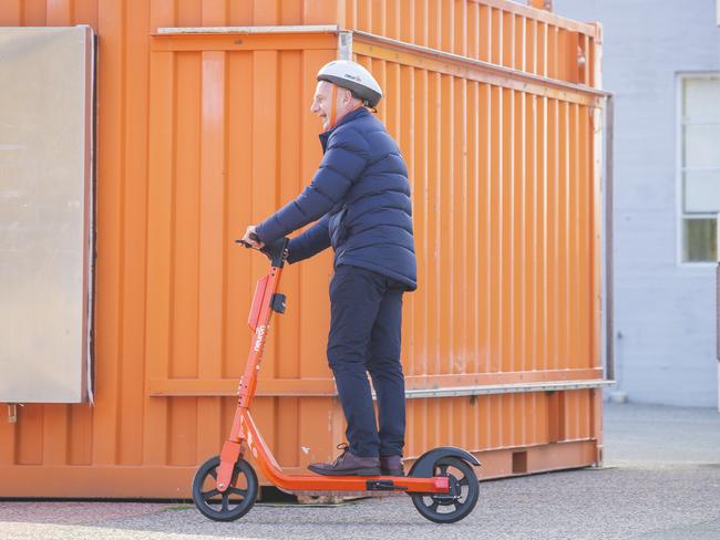 Premier Peter Gutwein rides an electric scooter at Princes Wharf earlier this year. Picture: NCA NewsWire / Richard Jupe