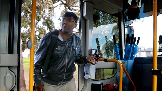 Passenger Jebin Varghese enters the On-demand bus at Schofields. Picture: AAP IMAGE / Angelo Velardo