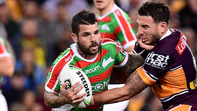 BRISBANE, AUSTRALIA - AUGUST 23: Adam Reynolds of the Rabbitohs is tackled by Darius Boyd of the Broncos during the round 23 NRL match between the Brisbane Broncos and the South Sydney Rabbitohs at Suncorp Stadium on August 23, 2019 in Brisbane, Australia. (Photo by Bradley Kanaris/Getty Images)