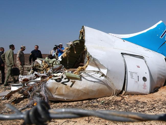 EGYPT. NOVEMBER 1, 2015. Russia's Emergency Situations Minister Vladimir Puchkov (4th L background) at the site where a Russian aircraft crashed in Egypt's Sinai Peninsula near El Arish city. Kogalymavia Airbus A321 came down in central Sinai as it traveled from Sharm el-Sheikh to St Petersburg, killing all 217 passengers and 7 crew members on board. PHOTOGRAPH BY TASS / Barcroft Media UK Office, London. T +44 845 370 2233 W www.barcroftmedia.com USA Office, New York City. T +1 212 796 2458 W www.barcroftusa.com Indian Office, Delhi. T +91 11 4053 2429 W www.barcroftindia.com (Photo credit should read TASS / Barcroft Media / Barcroft Media via Getty Images)