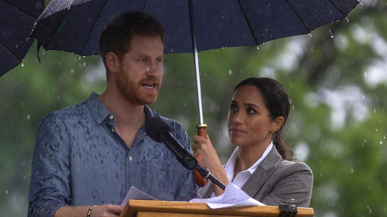 Prince Harry speaks at an event in Dubbo as his wife Meghan watches on. Picture: Ian Vogler/AP