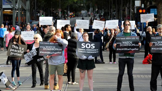 Vegan protesters block the intersection of Flinders and Swanston Street Melbourne in support of animal rights. Picture: Andrew Henshaw