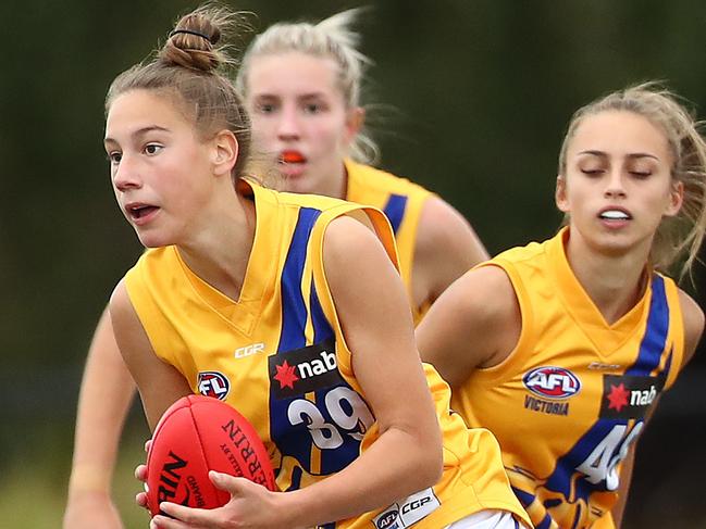 MELBOURNE, AUSTRALIA - MAY 11: Montana Ham of the Jets runs with the ball during the round nine NAB League girls match between the Western Jets and the Dandenong at Downer Oval on May 11, 2019 in Melbourne, Australia. (Photo by Kelly Defina/AFL Photos/Getty Images)