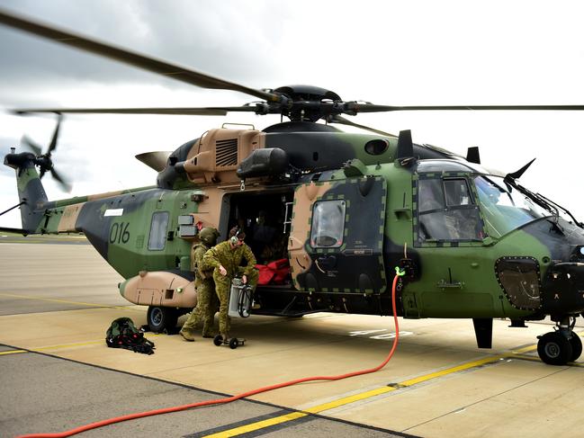 On board an MRH-90 Taipan during a flypass over the Townsville 400 Supercars event. Picture: Alix Sweeney