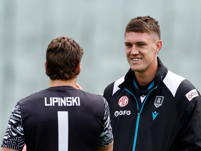 MELBOURNE, AUSTRALIA - APRIL 20: Patrick Lipinski of the Magpies and Jordon Sweet of the Power are seen before the 2024 AFL Round 06 match between the Collingwood Magpies and the Port Adelaide Power at the Melbourne Cricket Ground on April 20, 2024 in Melbourne, Australia. (Photo by Dylan Burns/AFL Photos via Getty Images)