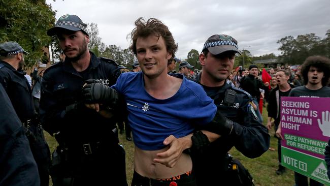 Protesters clash with police outside of the event. Picture: Toby Zerna