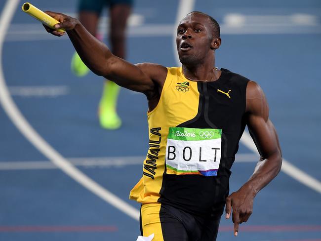 Usain Bolt of Jamaica celebrates winning the Men's 4x100m Relay.