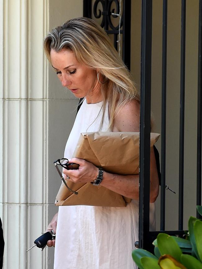 Tania Hird leaves the family Toorak home with her children on Friday. Picture: Nicole Garmston