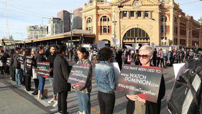 Protesters at the intersection of Flinders and Swanston Streets. Picture: AAP