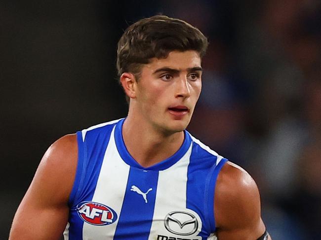MELBOURNE, AUSTRALIA - APRIL 05: Harry Sheezel of the Kangaroos takes possession of the ball during the round four AFL match between North Melbourne Kangaroos and Sydney Swans at Marvel Stadium, on April 05, 2025, in Melbourne, Australia. (Photo by Morgan Hancock/Getty Images)
