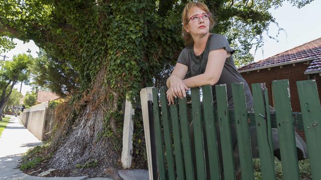 Haberfield resident Linda Viskovic who has a dangerous tree at the front of her property. Photo: Matthew Vasilescu