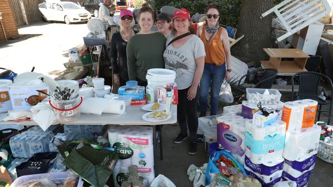 Doris Borkowski, her daughter Jessica and helpers at their street stall aiding fellow flood victims in Maribyrnong. Picture: David Crosling