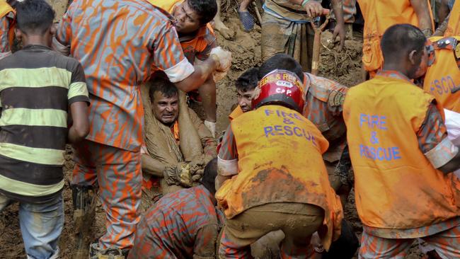 Rescuers pull out the dead body of a victim after Tuesday's massive landslide in Rangamati district, Bangladesh. Picture: AP Photo