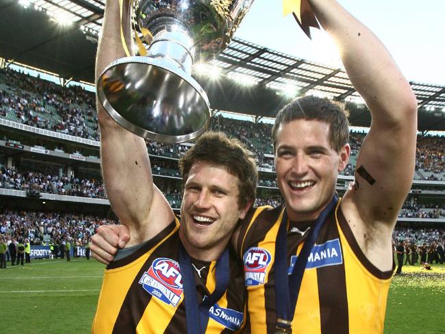 Trent Croad celebrates Hawthorn’s 2008 flag with Campbell Brown. 