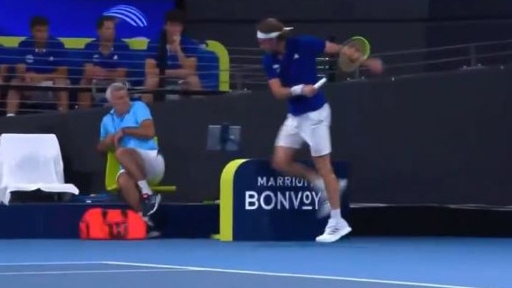 Stefanos Tsitsipas cracks his racquet and hits his dad in the process. Picture: Channel 9