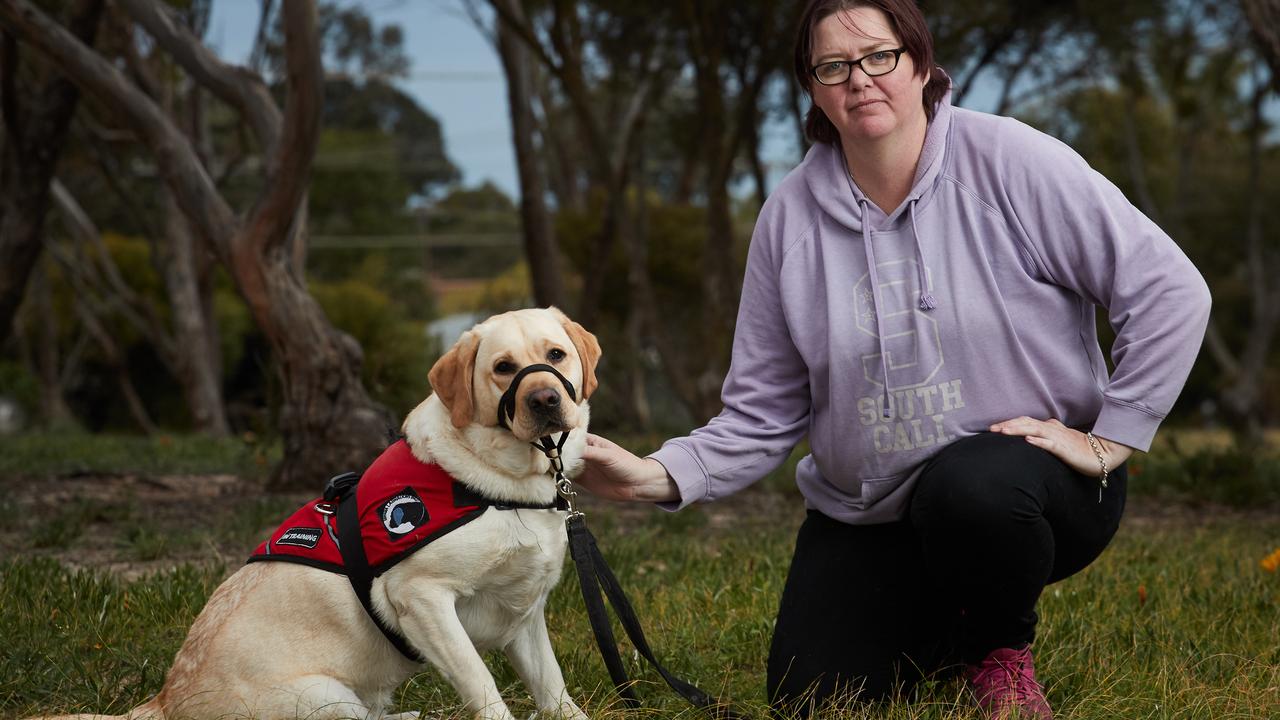 Murrianna Reese with her fully qualified assistance dog, Hunter, 3 outside her home in Murray Bridge, after they were refused a stay at Big 4 Marion Holiday Caravan Park. Picture: MATT LOXTON