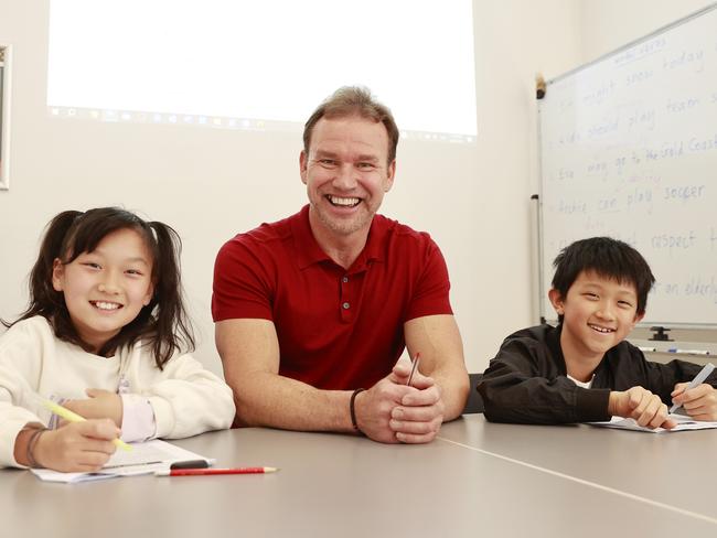 , ** HOLD FOR NETWORK ** Story on the business of school tutors. SEPTEMBER 9, 2023, Pictured with students Mia Hu and Anthony Chang, is Tim Ricketts who is a tutor and runs his business, Mr Tims Tutoring in Beecroft. Picture: Tim Hunter.