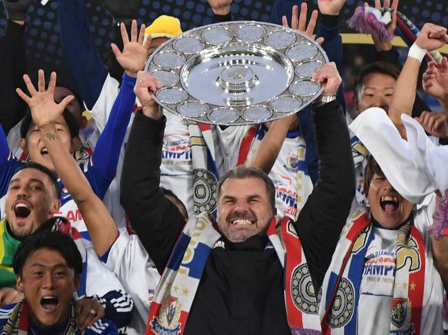 YOKOHAMA, JAPAN - DECEMBER 07: Coach,Ange Postecoglou of Yokohama F.Marinos lifts the J.League Champions Schale as they celebrate the J1 Season Champions after the J.League J1 match between Yokohama F.Marinos and FC Tokyo at Nissan Stadium on December 07, 2019 in Yokohama, Kanagawa, Japan. (Photo by Masashi Hara/Getty Images)
