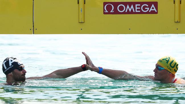 Domenico Acerenza of Team Italy and Kyle Lee of Team Australia congratulate each other after a photo finish. (Photo by Maddie Meyer/Getty Images)