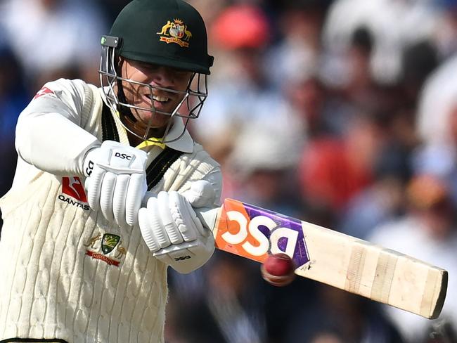 Australia's David Warner plays a shot on day three of the fourth Ashes cricket Test match between England and Australia at Old Trafford cricket ground in Manchester, north-west England on July 21, 2023. (Photo by Oli SCARFF / AFP) / RESTRICTED TO EDITORIAL USE. NO ASSOCIATION WITH DIRECT COMPETITOR OF SPONSOR, PARTNER, OR SUPPLIER OF THE ECB