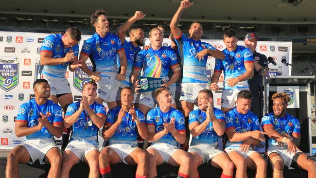 The Roosters celebrate winning the Auckland Nines after defeating the Panthers in the final. Picture: Mark Evans