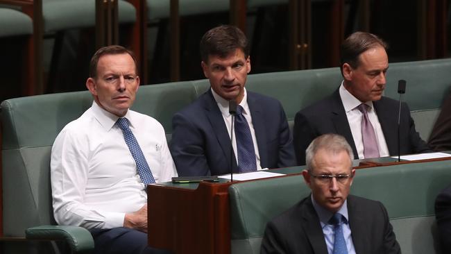 Tony Abbott and colleagues sit on the backbench in the Representatives Chamber at Parliament House in Canberra yesterday.