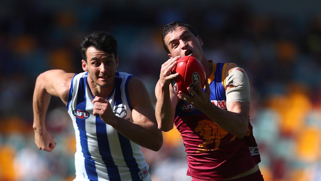 BRISBANE, AUSTRALIA - AUGUST 26: Tom Rockliff of the Lions takes a mark in 2017(Photo by Chris Hyde/Getty Images)