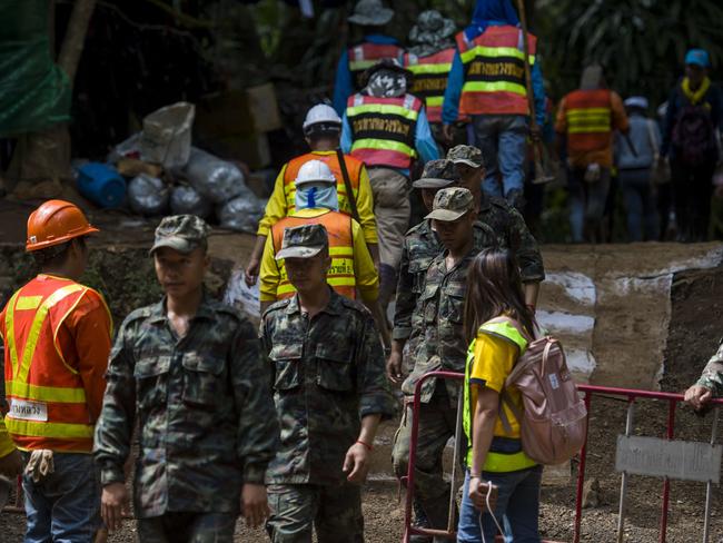 Others are searching for possible hidden passages into the mountain, to avoid sending the young boys on the dangerous four-hour journey through cramped and flooding caves. Picture: AFP Photo / YE AUNG THU