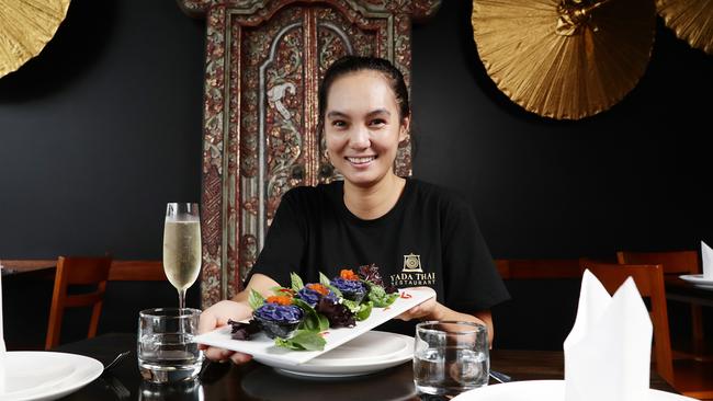 Co-owner of Yada Thai restaurant Eye Taveesuk serves a platter of the violet dumplings. Picture: Brendan Radke