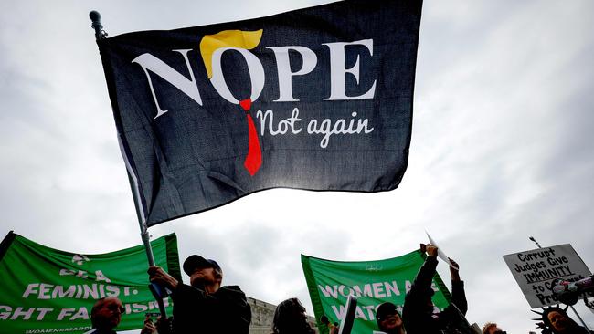 Demonstrators participate in a protest outside the US Supreme Court as it hears oral arguments in the Trump v. United States. Picture: Getty Images via AFP.