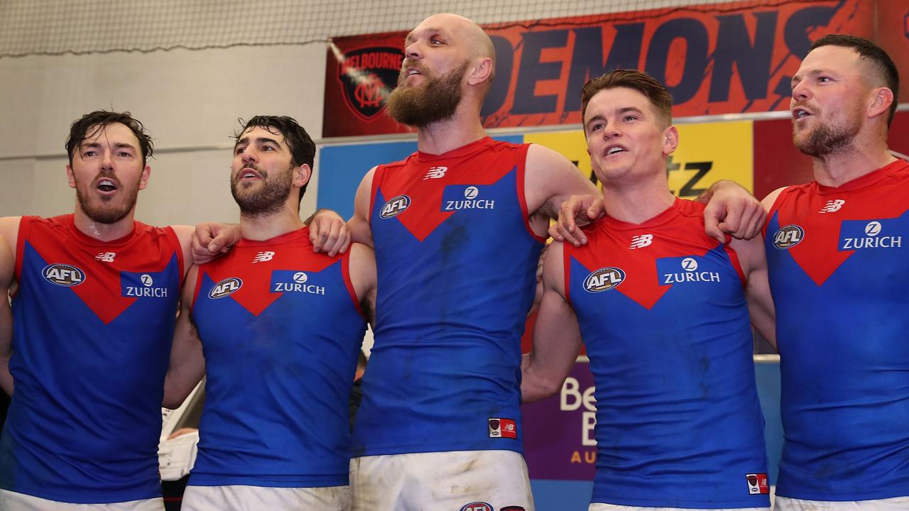 The Demons sing the team song after defeating the Fremantle Dockers. Picture: Will Russell