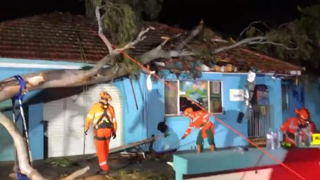 The tree landed on the roof of Quakers Hill Kindergarten and Child Care Centre on Saturday night. Picture: Blacktown SES