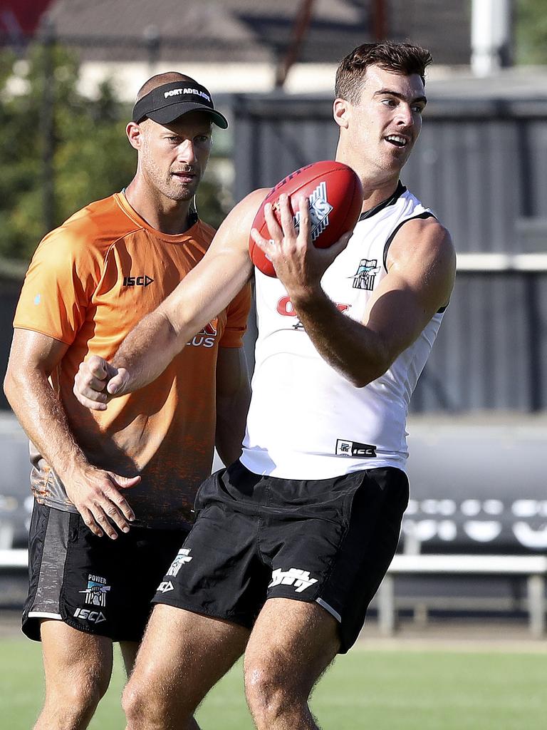 Scott Thompson watches Scott Lycett at Port training. The ruckman will make his Power debut in Port Pirie. Picture Sarah Reed